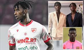 Breaking News: Ex-Barcelona defender is ‘accused of making his TWIN brother play in his place for Dinamo Bucharest, with duo rumbled because the other sibling is unable to speak English……..